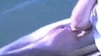 Dolphin fetish zoophilia by the pool and finger fucking