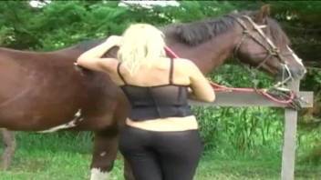 Sexy blonde in outdoor scenes of raw horse porn