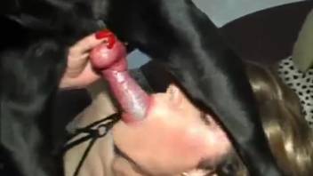 Aroused feminized sub deepthroating a black canine's moist cock